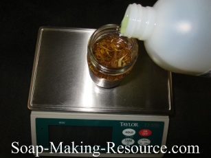 Measuring Olive Oil into Mason Jar