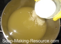 Pouring Almond Milk into Honey Oatmeal Soap