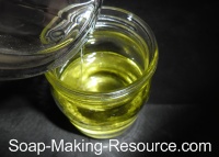 Pouring Essential Oils into the Grapeseed Oil Pouring Essential Oils into the Grapeseed Oil