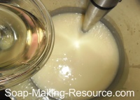 Pouring Essential Oils into Soap