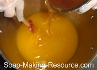 Pouring Honey into Honey Soap Recipe Pouring Honey into Honey Soap Recipe