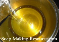 Pouring Liquid Oils into Body Butter Batch