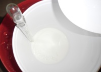 Pouring Lye into Goat's Milk Pouring Lye into Goat's Milk