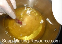 Pouring Lye into the Oils Pouring Lye into the Oils