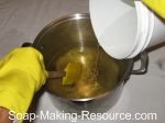 pour lye solution into soap making oils