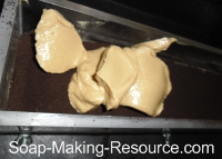 Pouring Second Coffee Soap Layer into Mold Pouring Second Coffee Soap Layer into Mold