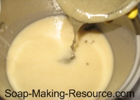Pouring Small Bentonite Clay Soap Portion into Rest of Batch Pouring Small Bentonite Clay Soap Portion Into Rest of Batch