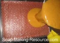 Pouring Soap into Bubble Wrap Lined Mold