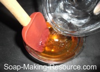 Pouring Water into Honey for Dilution Pouring Water into Honey for Dilution