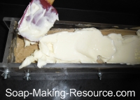 Pouring White Coffee Soap Layer into Mold Pouring White Coffee Soap Layer into Mold