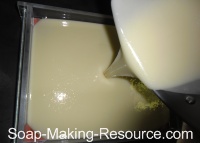 Pouring White Handmade Soap Recipe Portion into Mold