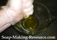 Squeezing Calendula-infused Jojoba Oil Out of the Calendula Petals