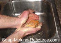 washing hands with annatto seed soap