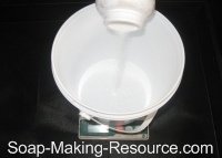 Pouring Lye into Container Pouring Lye into Container