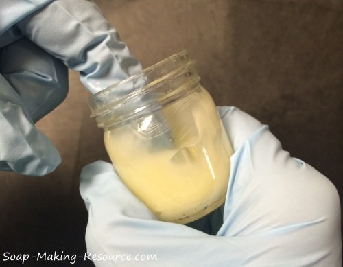 Filling our Open Mouth Jars with the Tea Tree Oil Ointment Recipe