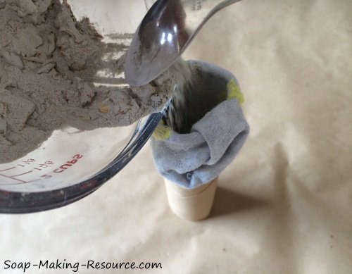 Pouring the Homemade Shoe Deodorizer into the Sock