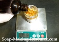 Measuring Jojoba Oil into Mason Jar