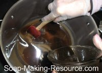 Mixing Black Walnut Hull Colored Soap into the Rest of the Batch