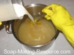 pour almond milk into homemade soap