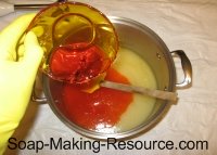 pouring annatto infused oil