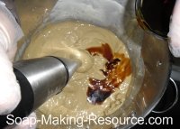 Pouring Essential Oils into Batch