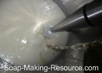 Pouring Essential Oils into Soap