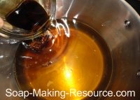 Pouring Essential Oils into Batch