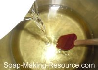 Pouring Lye into Oils Pouring Lye into Oils