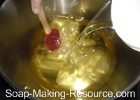 Pouring Lye Solution into Handmade Soap Recipe