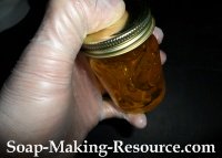 Shaking the Jojoba Oil Ointment Recipe to Mix in the Ingredients