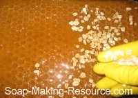 Sprinkling Oats onto Top of Soap