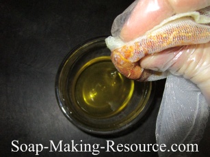 Squeezing the Bunched Calendula Petals at the Bottom of the Cloth Filter